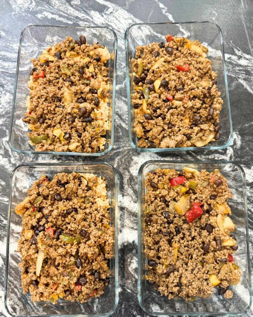 Ground beef taco mixture divided into meal prep containers