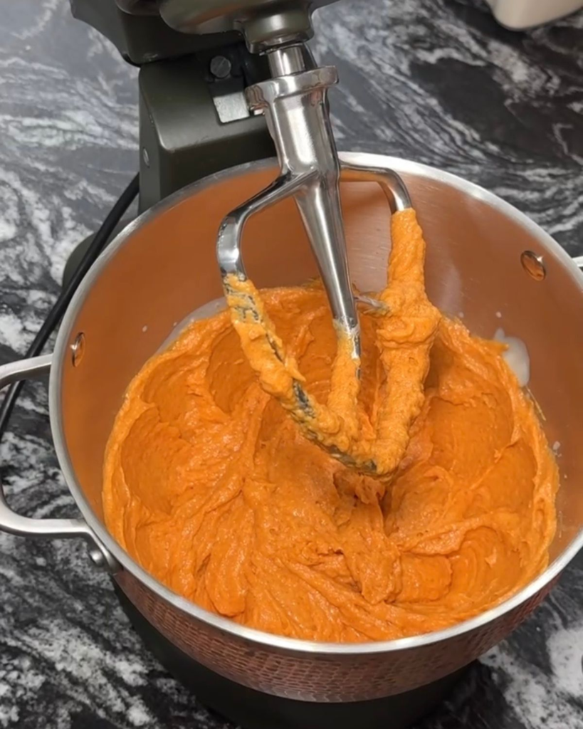 Pumpkin cookie wet ingredients mixed in a stand mixer before adding the dry ingredients