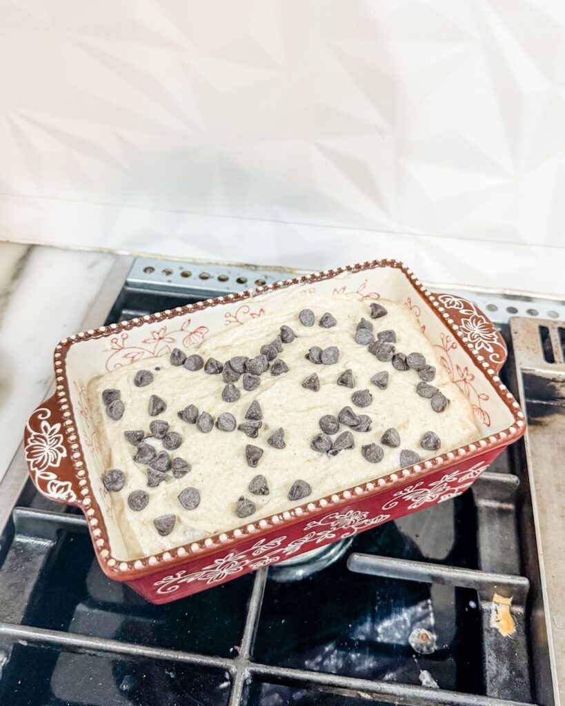 Homemade sourdough discard banana bread dough in a loaf pan.