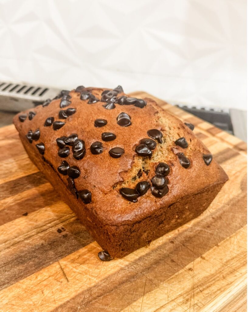Close-up of moist sourdough discard banana bread with chocolate chips.
