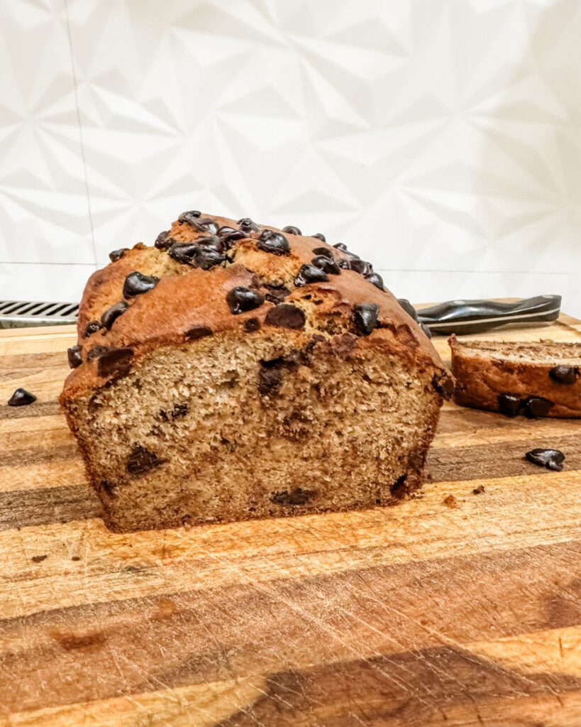 Sourdough discard banana bread sliced and served on a plate.