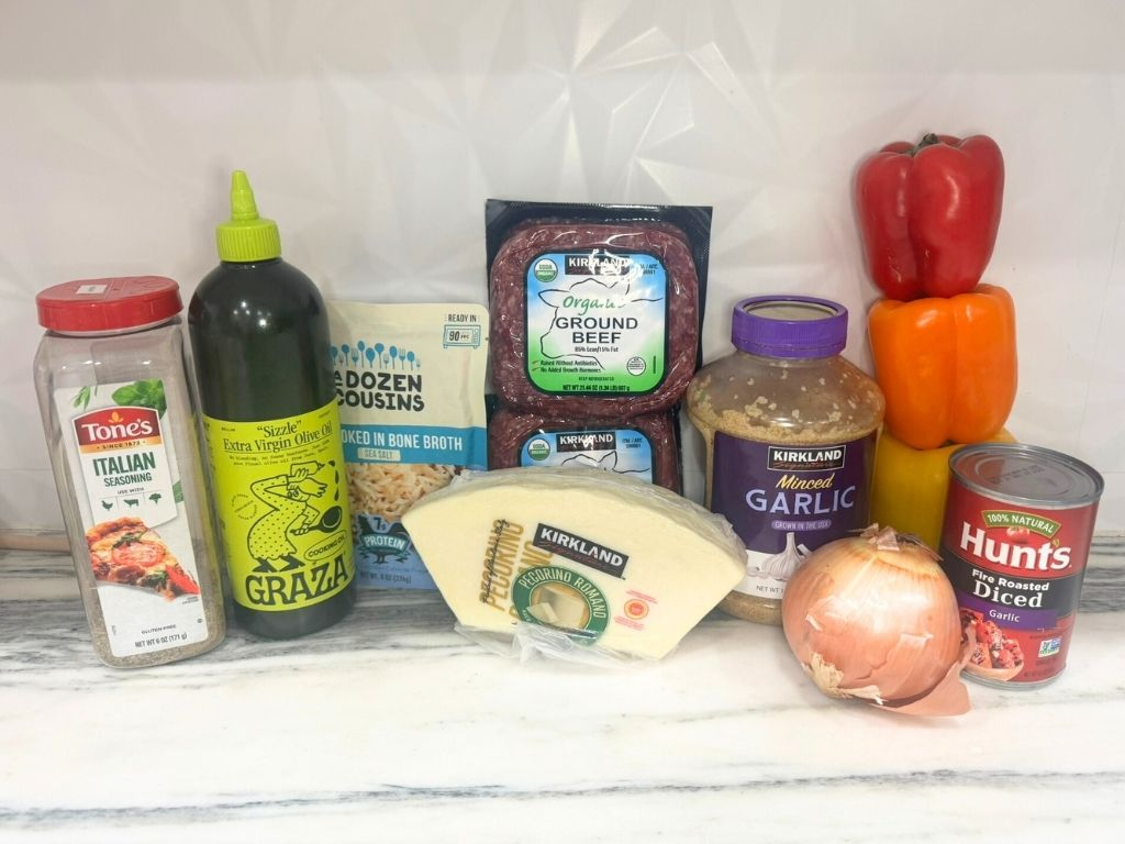 ingredients for unstuffed pepper skillet including ground beef rice bell peppers and tomato sauce