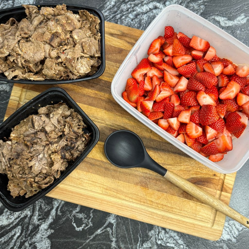 Sunday protein prep with ground beef and fresh fruit for a simple weekly dinner system for busy moms.