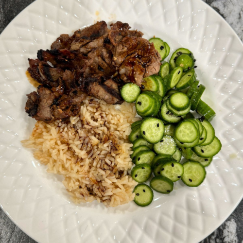 Costco shabu shabu beef served with jasmine rice and cucumber salad for an easy weeknight dinner.