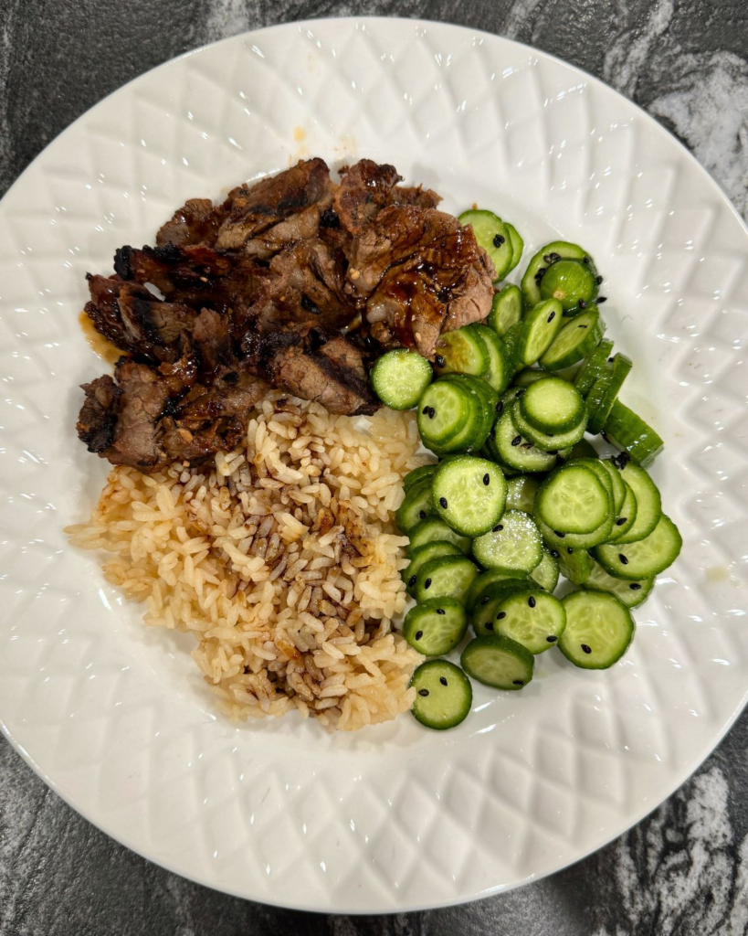 Costco shabu shabu beef recipe served with jasmine rice and cucumber salad for an easy weeknight dinner.