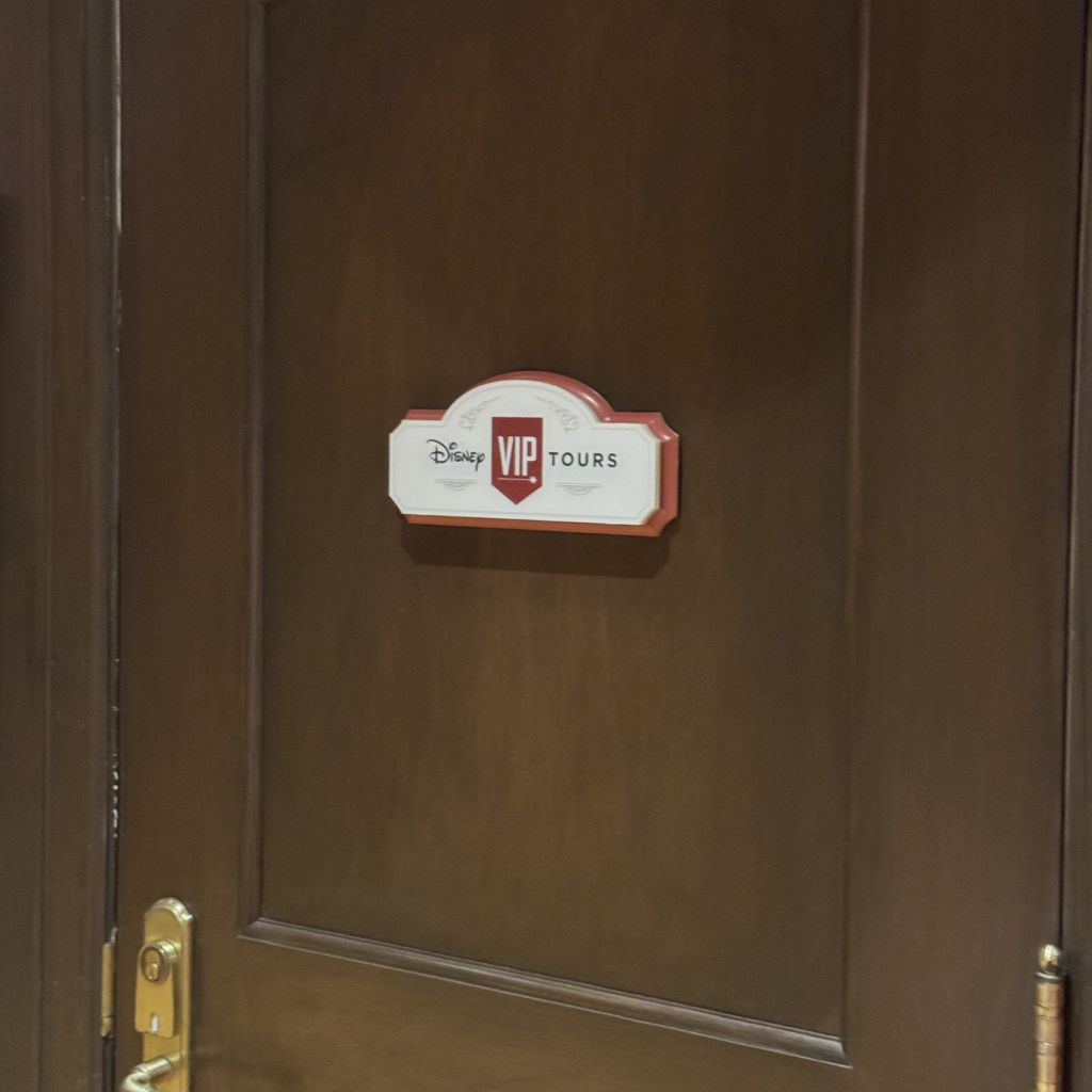 Door sign for Disney VIP Tours private guest services location