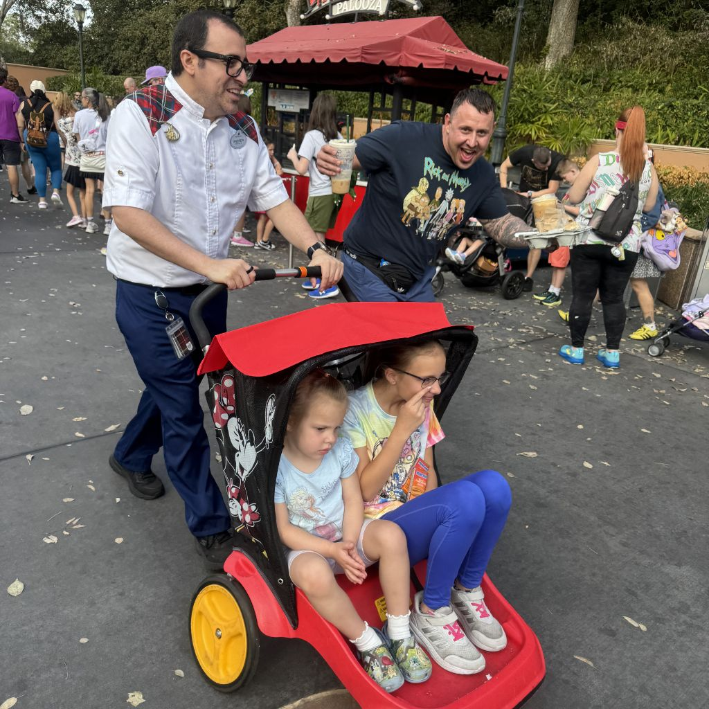Disney guide pushing stroller through Hollywood Studios during private tour