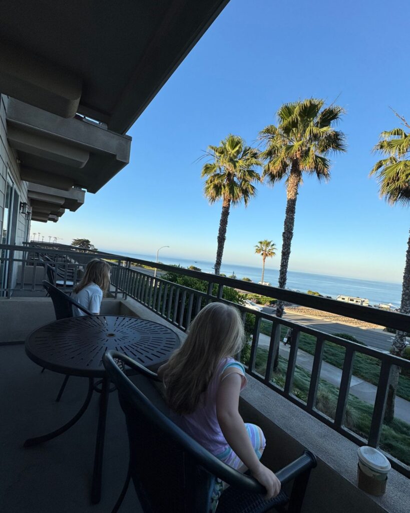 Kids enjoying the ocean view from the hotel balcony in Carlsbad California