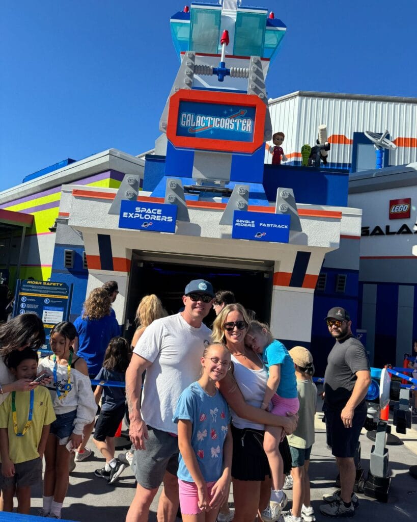 Family standing in front of LEGO Galaxy Explorer ride at LEGOLAND California