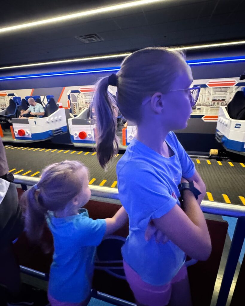 Kids waiting in line for LEGO themed ride inside LEGOLAND California