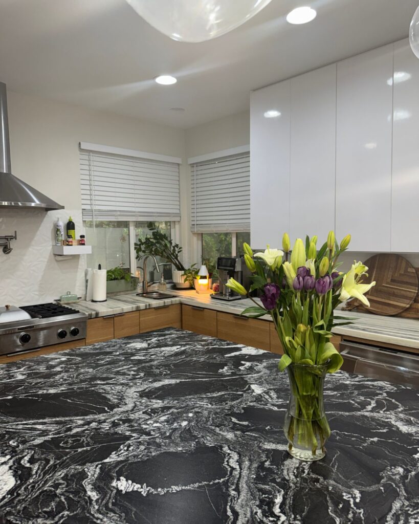 cozy clean kitchen after a Sunday reset routine with soft lighting and fresh flowers