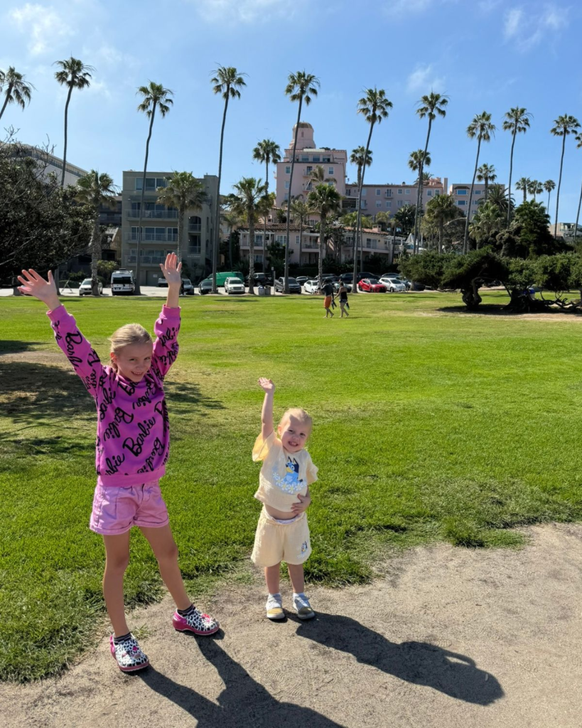 Two girls posing in front of La Valencia Hotel in La Jolla, California.