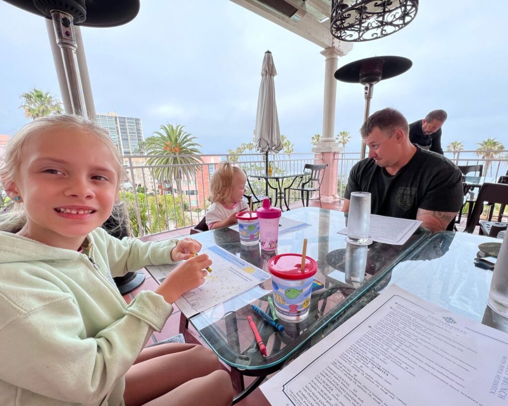 Family breakfast on the outdoor patio at La Valencia Hotel overlooking La Jolla.