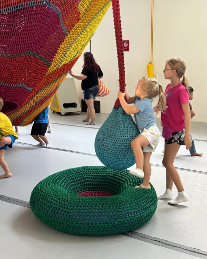 two girls playing at the new childrens musuem in san diego