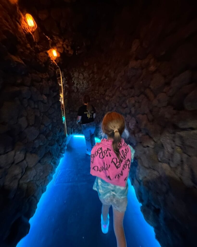 young girl walking in a speakeasy in pacific beach