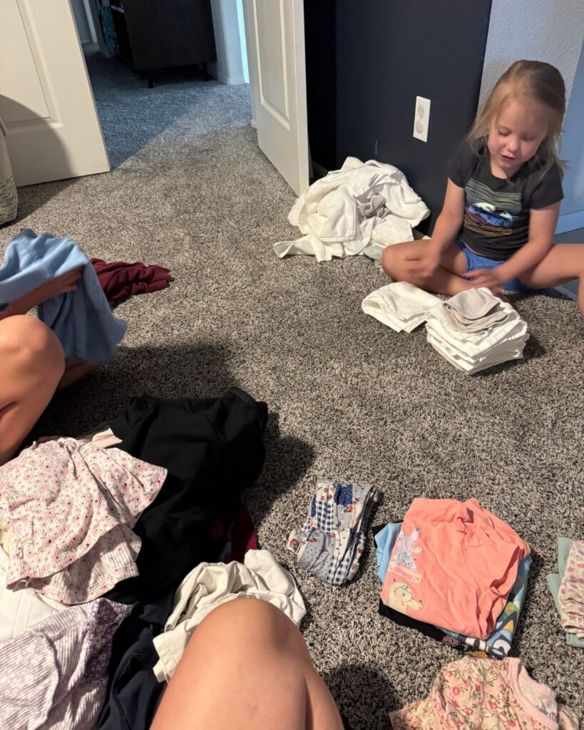 simple-mom-routine-folding-laundry-with-daughters