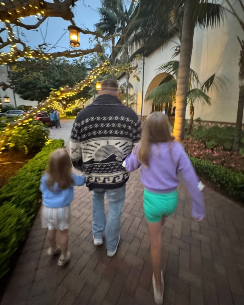 Dad and daughters walking the grounds of Terranea Resort after dinner.