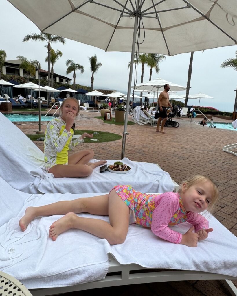 Two girls enjoying nachos pool side at Terranea Resort Pool