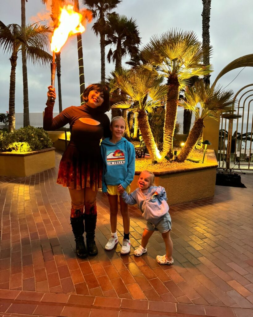 Kids watching the evening fire dancer performance at Pacific Terrace Hotel.