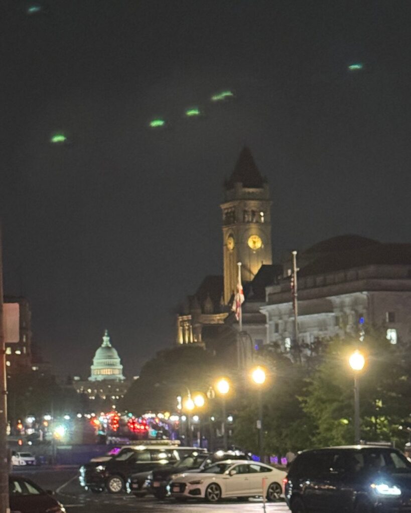 United States Capitol Building illuminated at night in Washington DC.