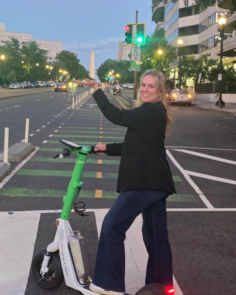 Couple riding electric scooters around Washington DC.