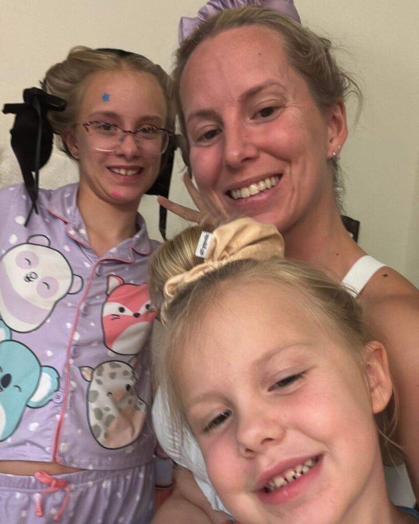 Mom and two daughters with their hair prepped before bed for easier school mornings