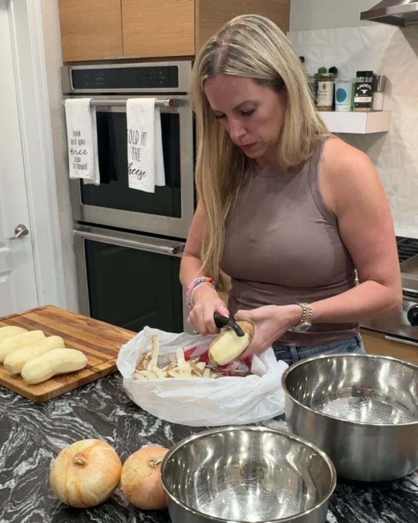Peeling potatoes while preparing loaded cheesesteak bowls for an easy family dinner