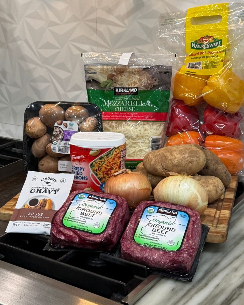 Ingredients for loaded cheesesteak bowls including ground beef, potatoes, bell peppers, onions, mushrooms and mozzarella cheese
