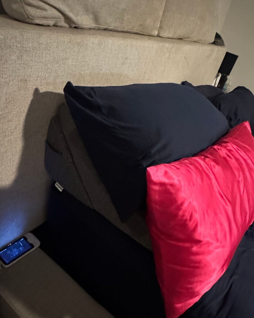 Wedge pillow and extra pillows used for sleeping during breast surgery recovery