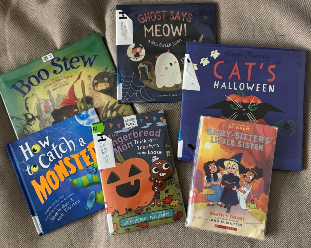 Stack of fall and Halloween books from the library for kids
