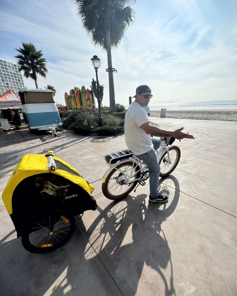 Man riding a bicycle along the beach in Coronado