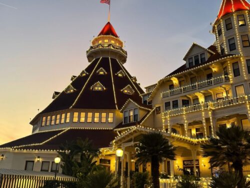 Hotel Del Coronado illuminated with Christmas lights at sunset