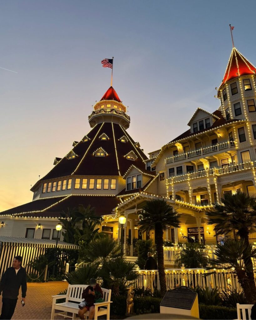 Hotel Del Coronado illuminated with Christmas lights at sunset
