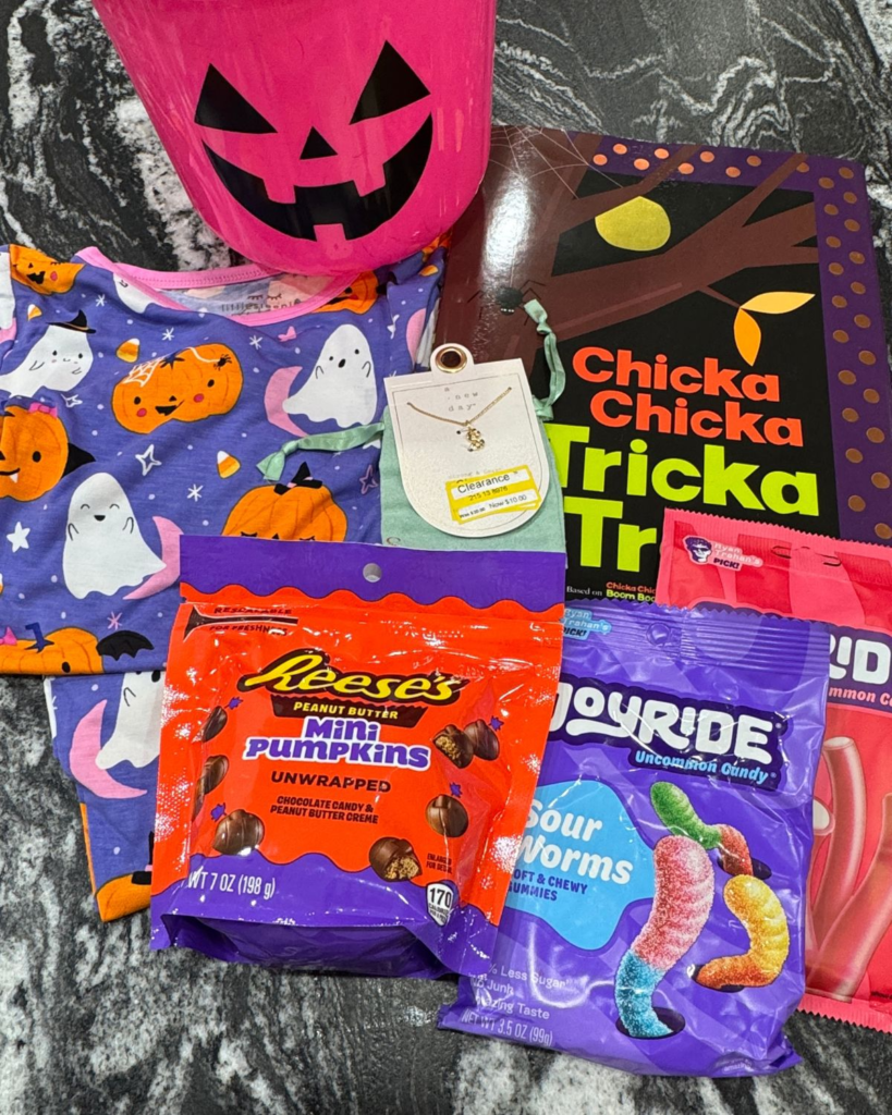 Halloween boo basket items for a 4-year-old, including candy, small toys, and festive treats