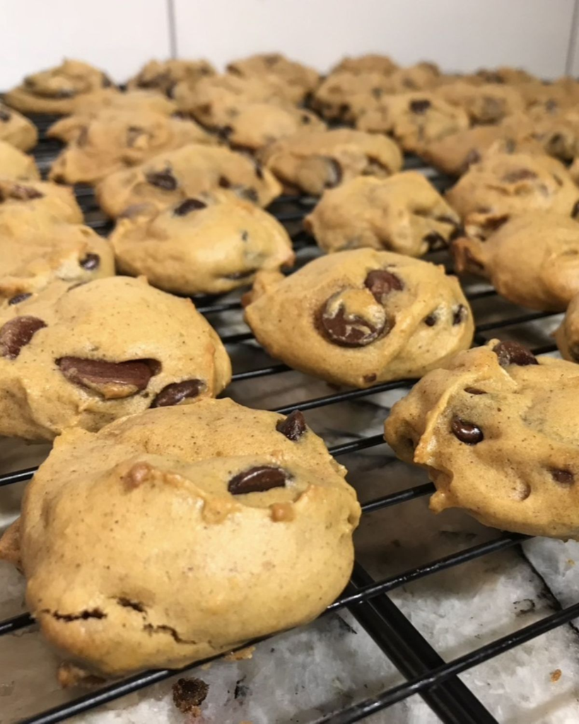 Homemade pumpkin chocolate chip cookies cooling on wire racks after baking