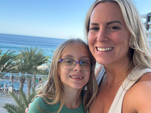 Mom and daughter smiling together at Garza Blanca Cabo
