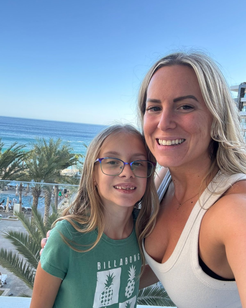 Mom and daughter smiling together at Garza Blanca Cabo
