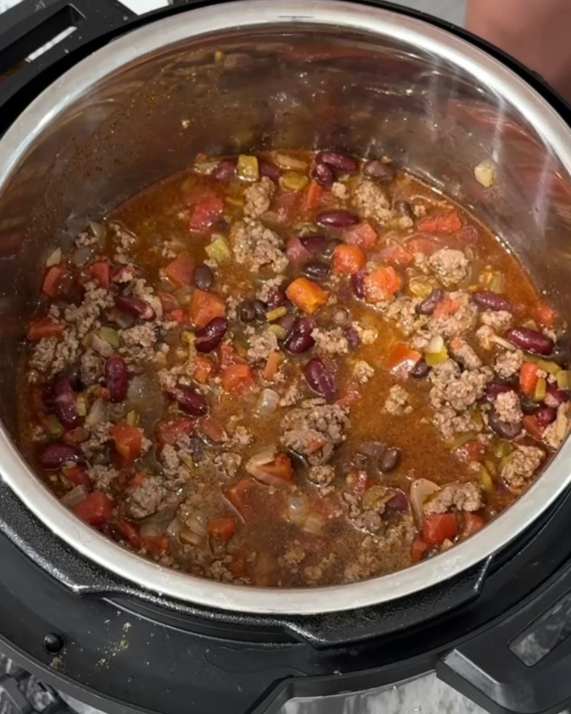 Slow cooker chili with ground beef, beans, tomatoes, and green chiles