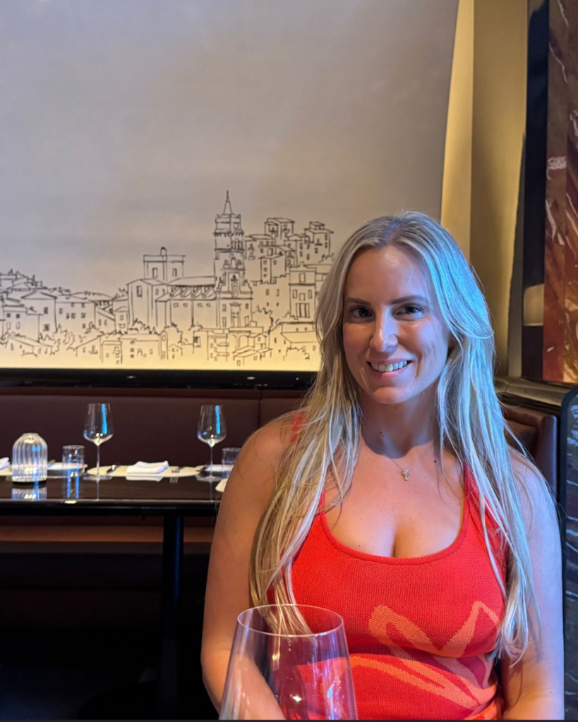 Julie seated at a table inside Sartiano’s at Wynn Las Vegas